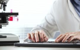 Man typing on a keyboard