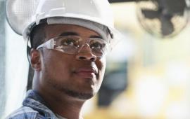 Young man wearing helmet and safety glasses