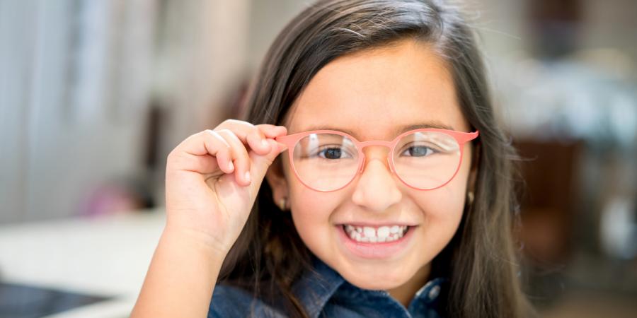 Smiling girl with new glasses